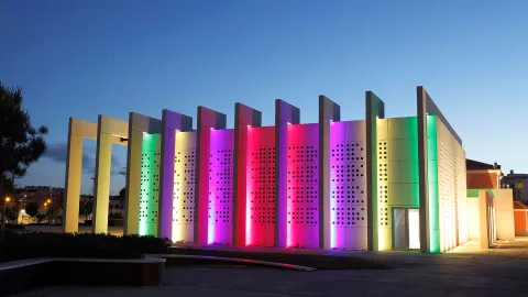 Dynamic architectural lighting creates an inviting landscape for visitors to Casa da Música Jorge Peixinho